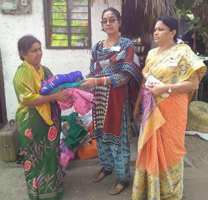 Padamata Bhuvaneshwari donating clothes