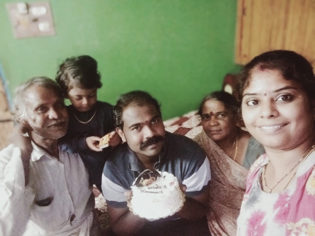 Kishore Kumar Polimera with his family