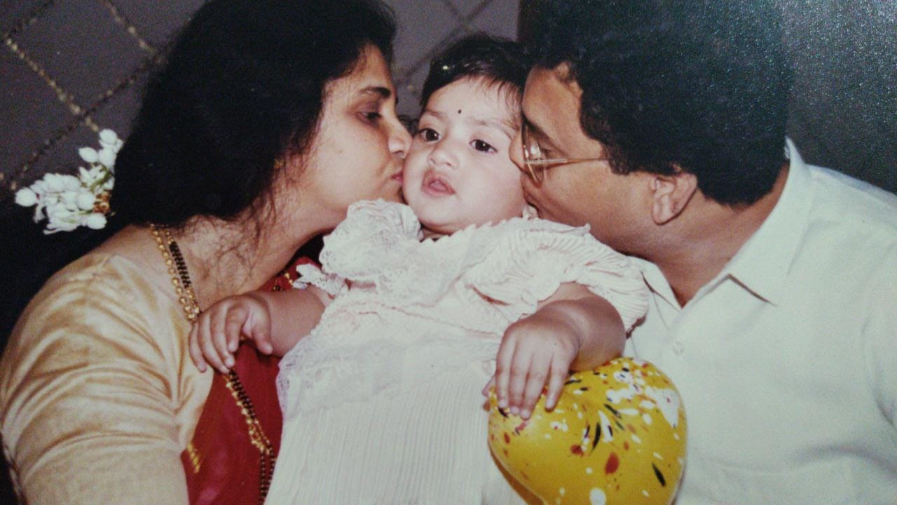 Nikita Raje with her parents