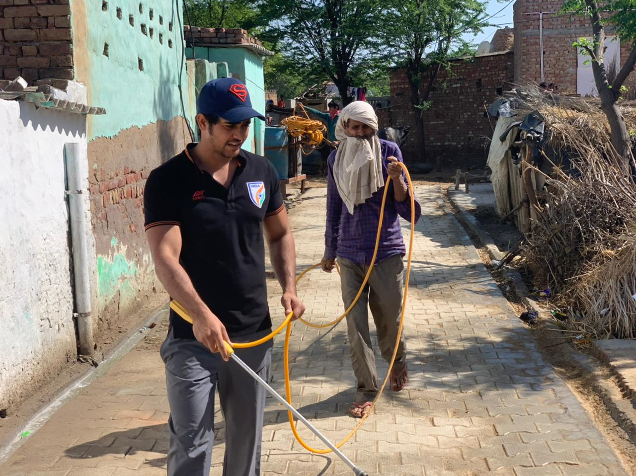 Nasir Khan - Cleaning the streets of the village