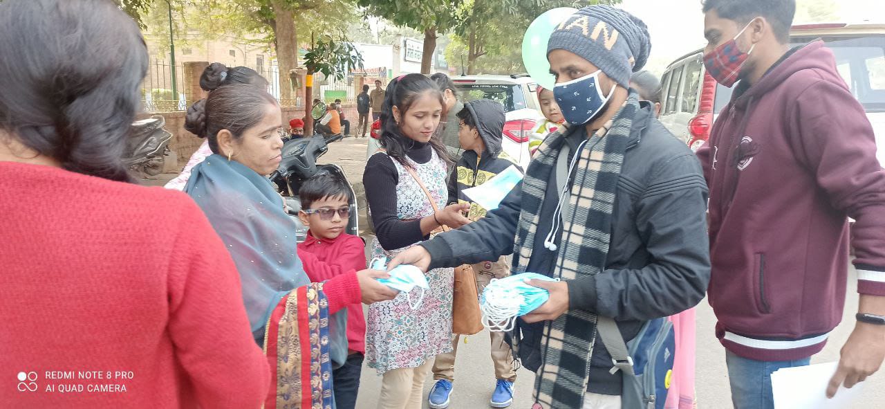 Akash Barua distributing masks