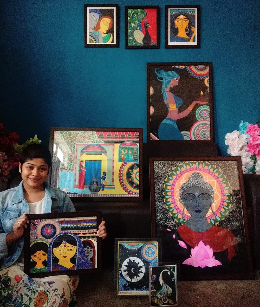 Parisha Dutta with her paintings