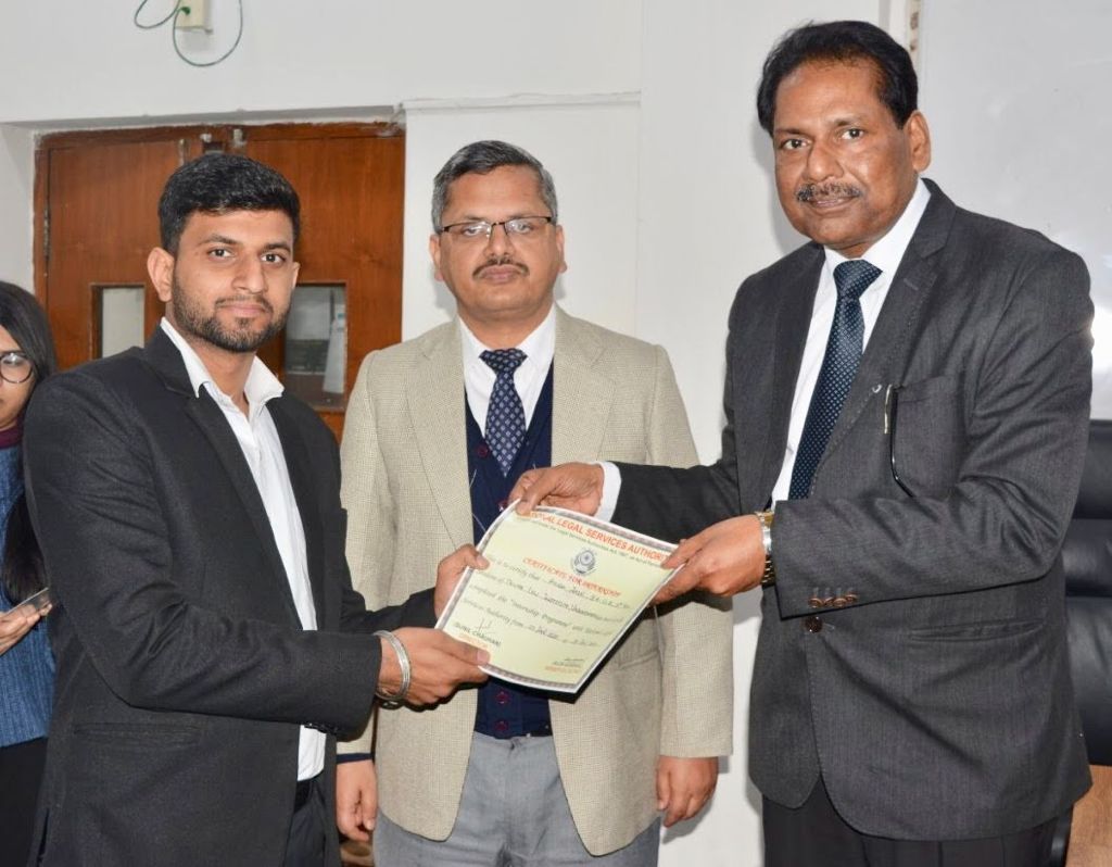 Ayush Jain receiving certificate from Director